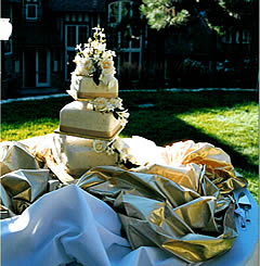 Creme and gold ribbon wedding cake.