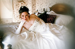 Bride laying on bed.