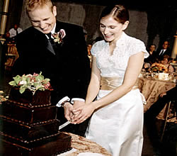 couple and chocolate wedding cake.