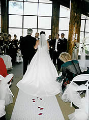 Bride and dad walking down the aisle.